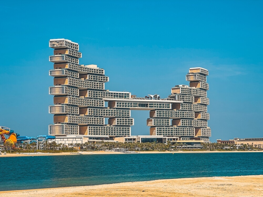 Unique luxury hotel building with a bridge structure in Dubai.