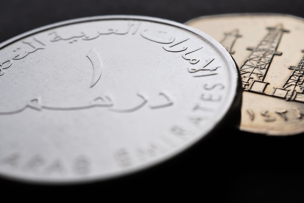 Close-up of United Arab Emirates coins showing intricate designs.