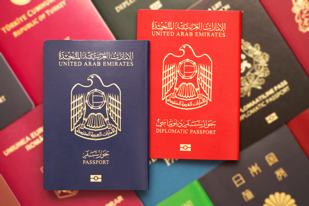 Closeup of United Arab Emirates passports on a colorful background.